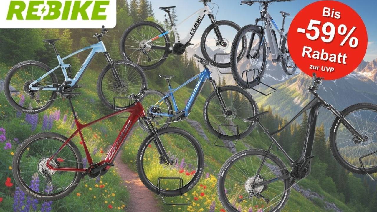 Fünf E-Mountainbikes der Marken Cube, Corratec, KTM und mehr in verschiedenen Farben (hellblau, weiß-schwarz, rot, blau, schwarz), präsentiert vor einer alpinen Berglandschaft mit Blumenwiese. Ein roter Kreis-Badge oben rechts zeigt „Bis -59 % Rabatt zur UVP". Logo von REBIKE oben links.