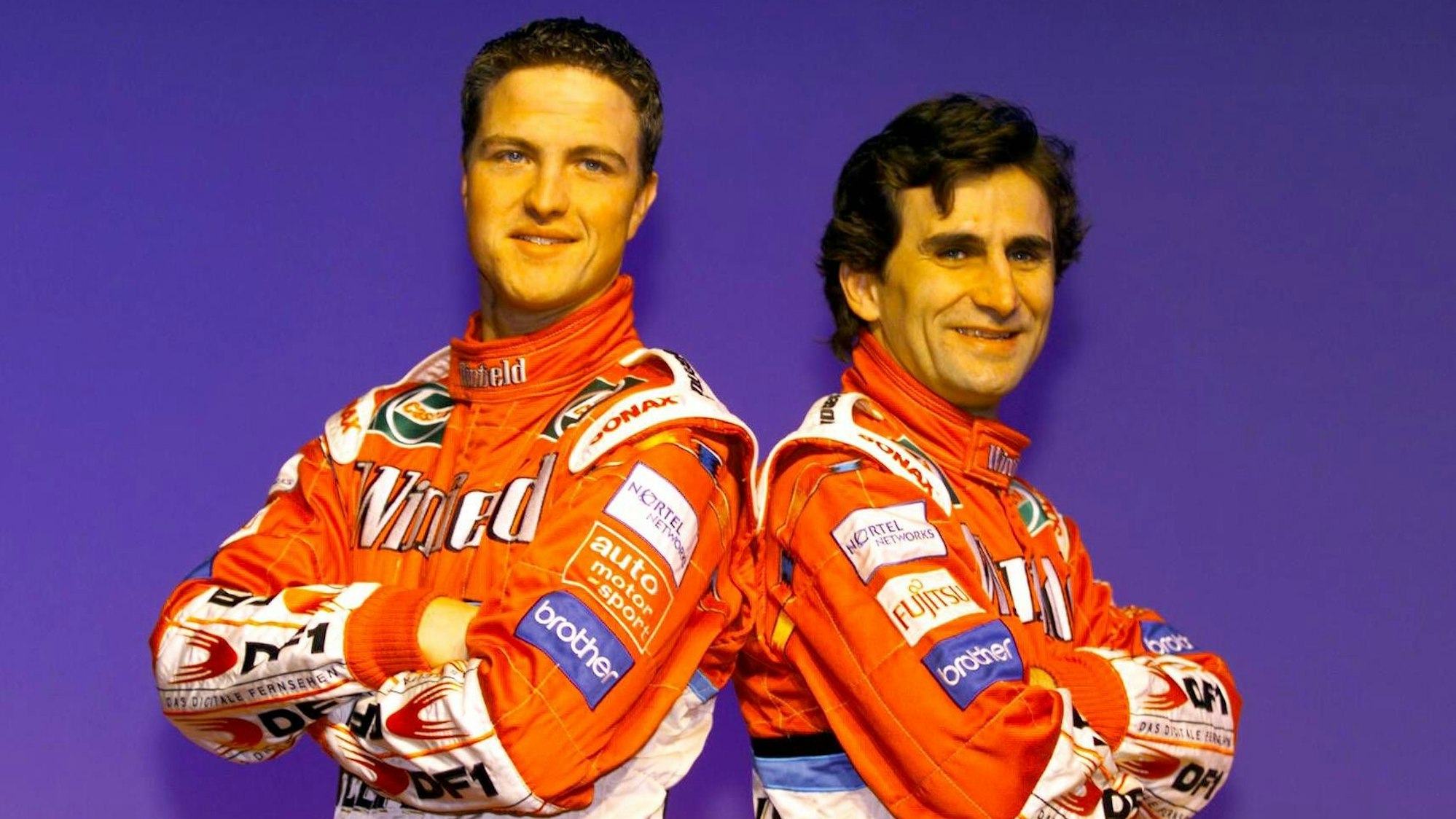 Ralf Schumacher und Alex Zanardi posieren gemeinsam für die Kamera.