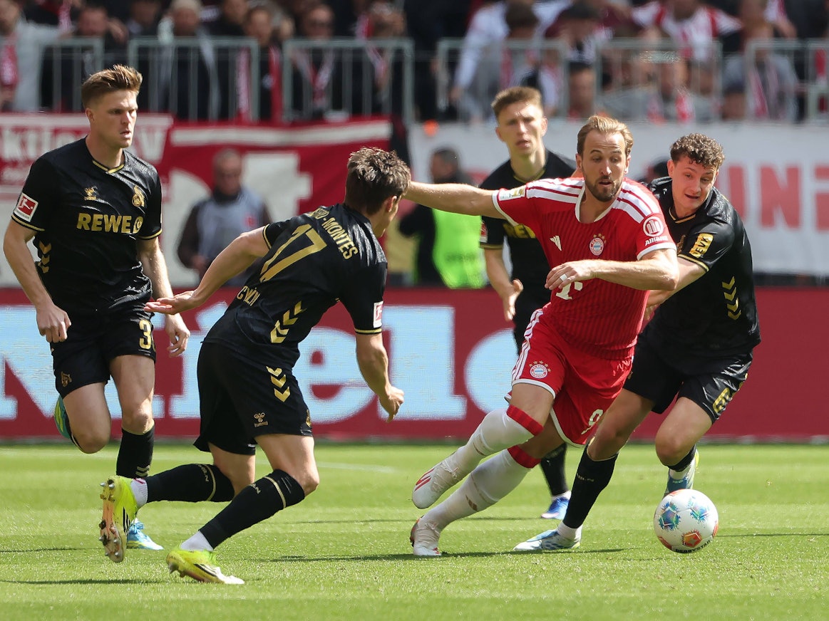 Eric Martel im Zweikampf mit Harry Kane.