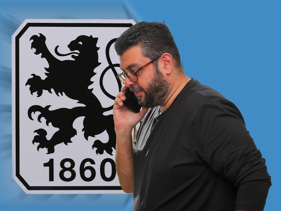 Hasan Ismaik telefoniert vor dem 1860-Logo.
