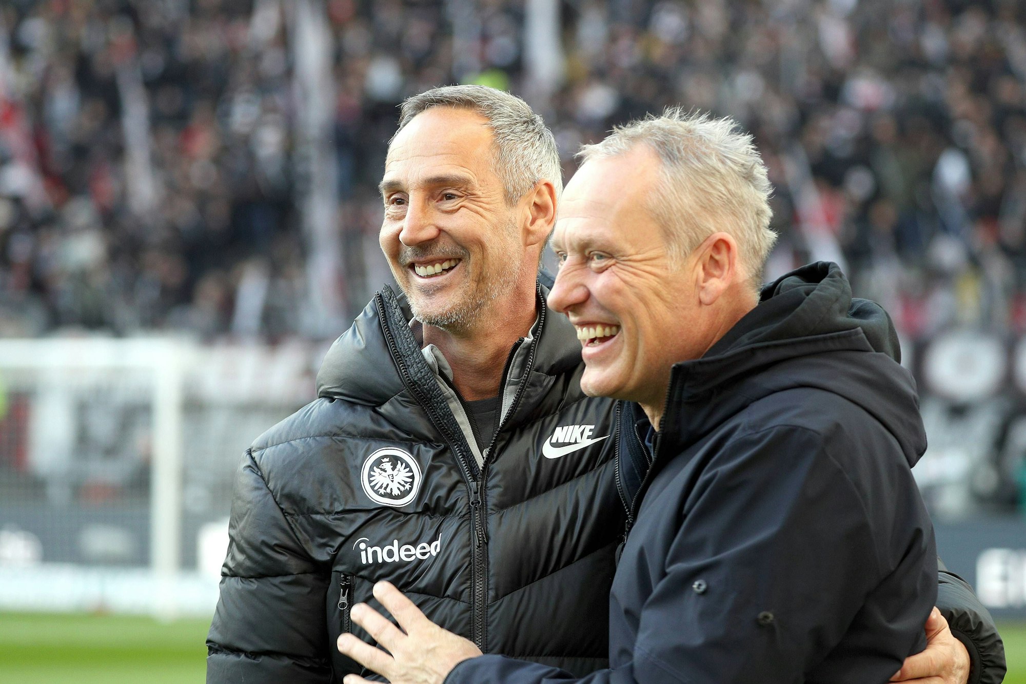Adi Hütter und Christian Streich lächeln.