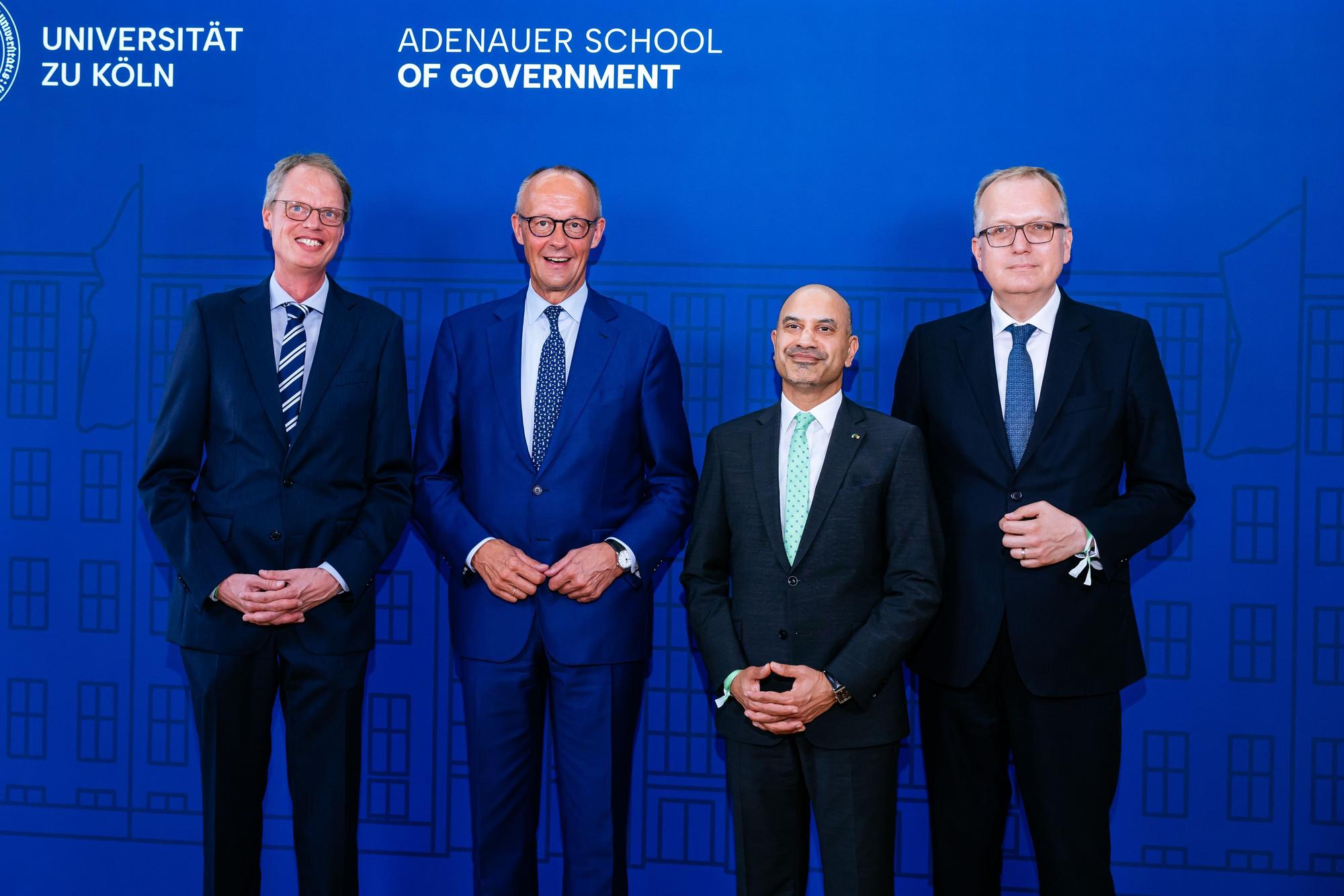 13.07.2026, Köln: Eröffnungsfeier der Adenauer School of Government an der Universität zu Köln v.l.: Prot. Dr. Axel Ockenfels , Friedrich Merz, Prof. Dr. Joybrato Mukherjee,Prof. Dr. Joybrato Mukherjee Foto: Costa Belibasakis.