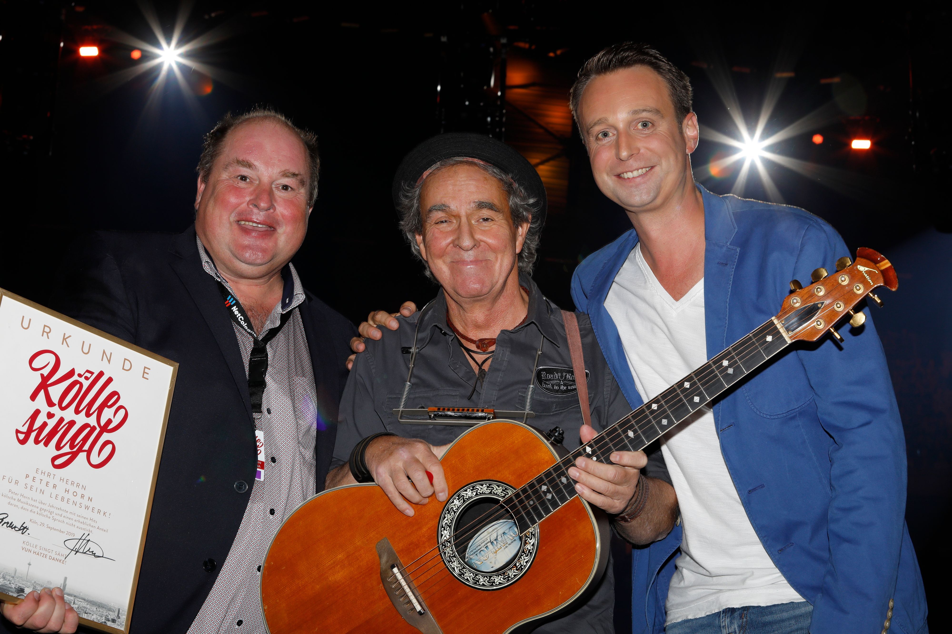 Stephan Brandt, Peter Horn und Lukas Wachten stehen auf der Bühne.