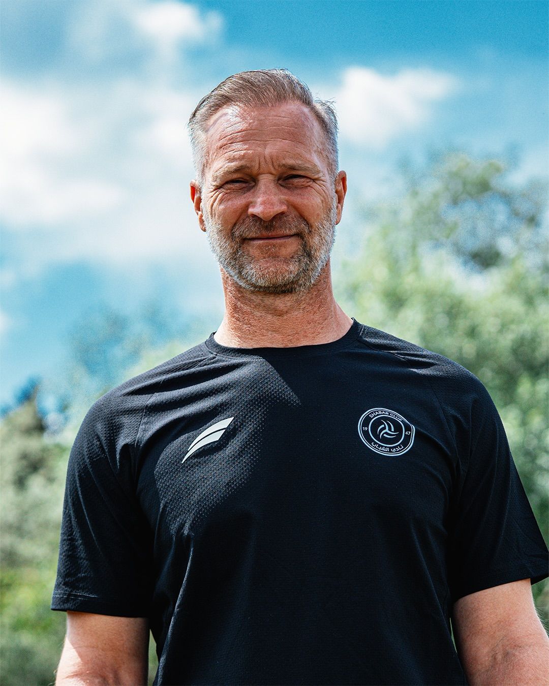 Uwe Gospodarek lächelt in die Kamera.