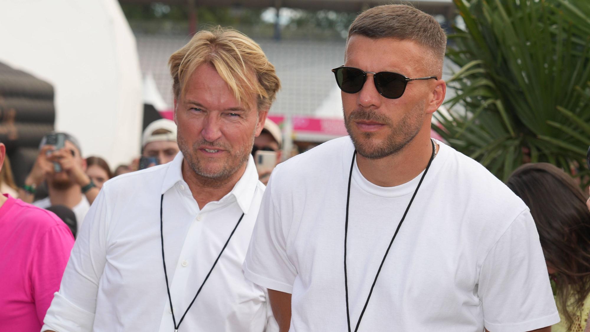 Markus Krampe und Lukas Podolski beim Glücksgefühle-Festival.