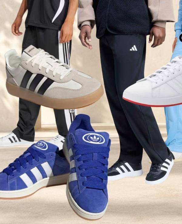 adidas Sneaker, Sportmode, Trainingshosen, Trainingsjacken vor einem hellen, steinartigen Hintergrund.