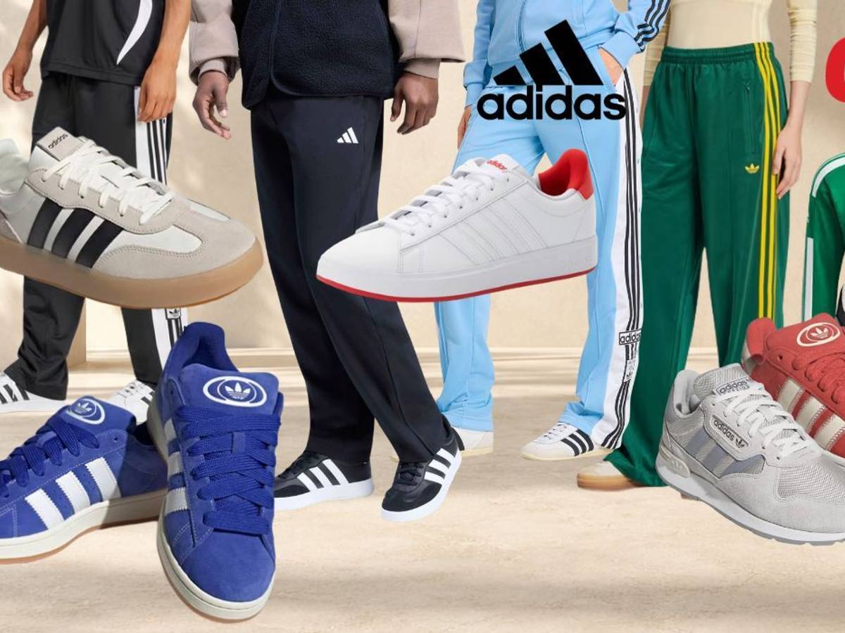 adidas Sneaker, Sportmode, Trainingshosen, Trainingsjacken vor einem hellen, steinartigen Hintergrund.