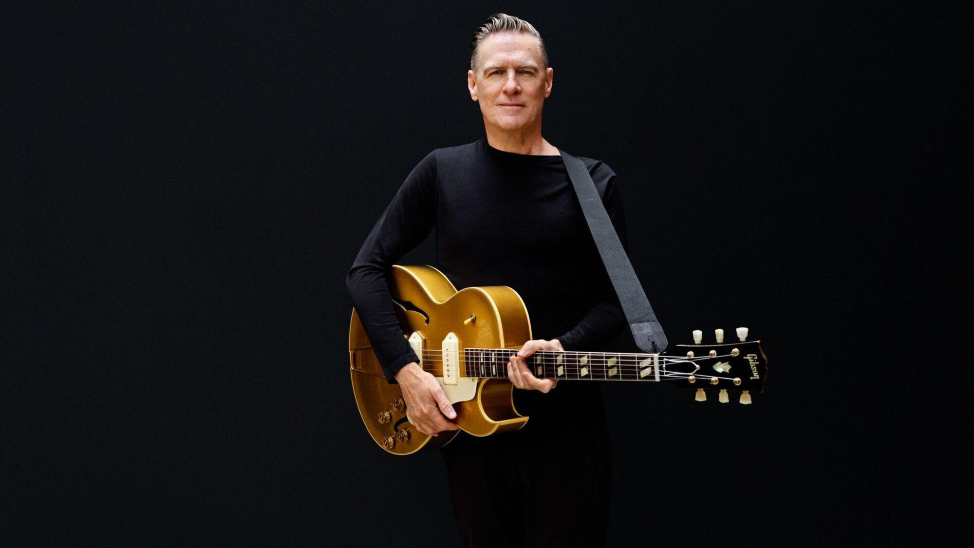 Bryan Adams mit seiner Gitarre.