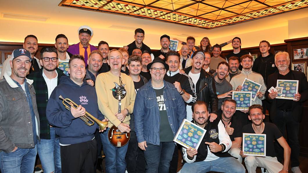 Gruppenbild der Musiker zur Sampler-Präsentation „Kölsch & Jot – Top Jeck 2027“.