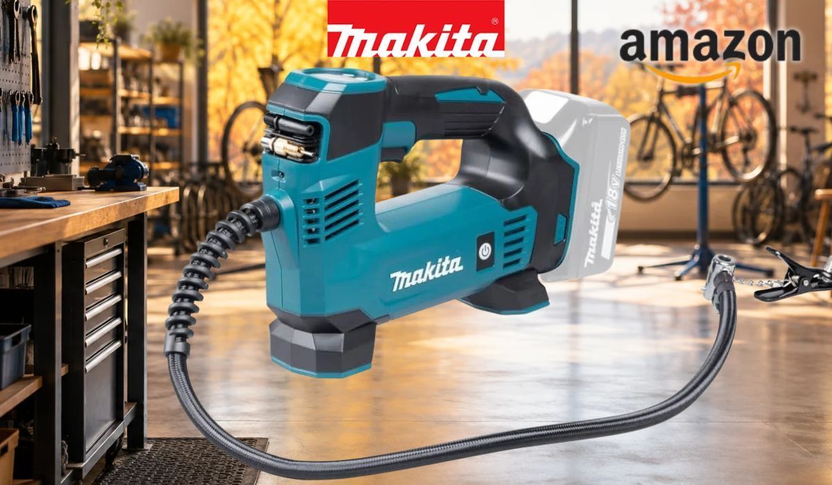 Makita DMP180Z Akku-Kompressor vor Fahrradwerkstatt im Hintergrund.