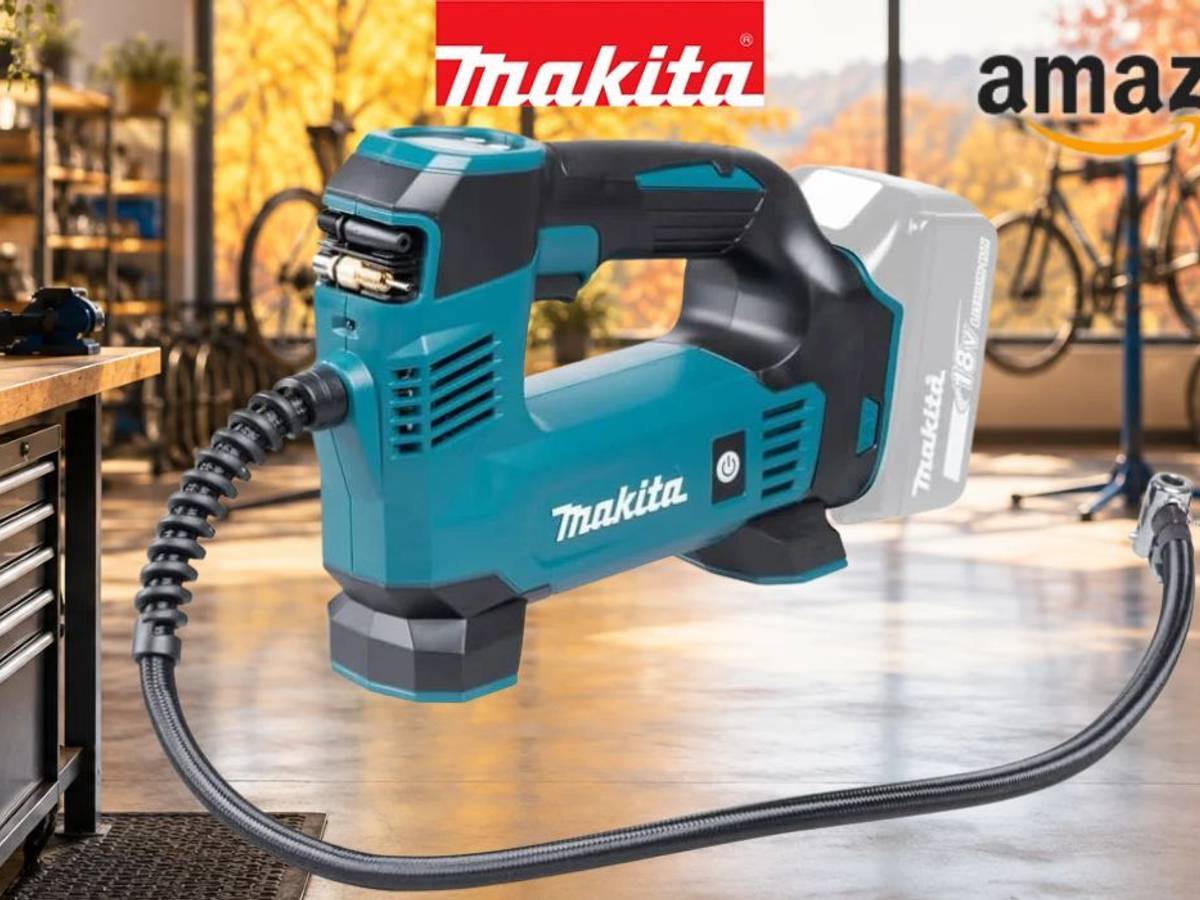 Makita DMP180Z Akku-Kompressor vor Fahrradwerkstatt im Hintergrund.