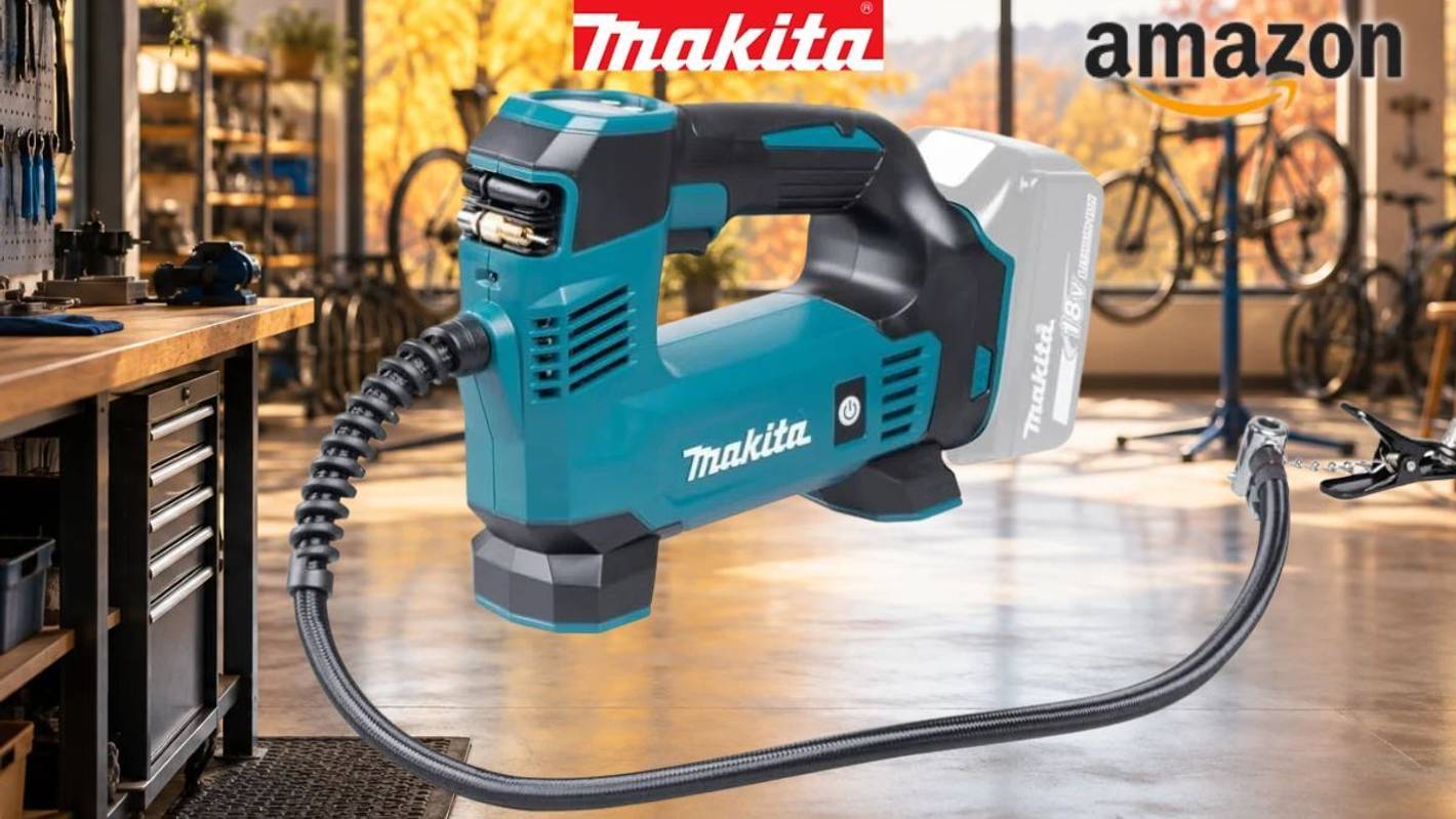 Makita DMP180Z Akku-Kompressor vor Fahrradwerkstatt im Hintergrund.